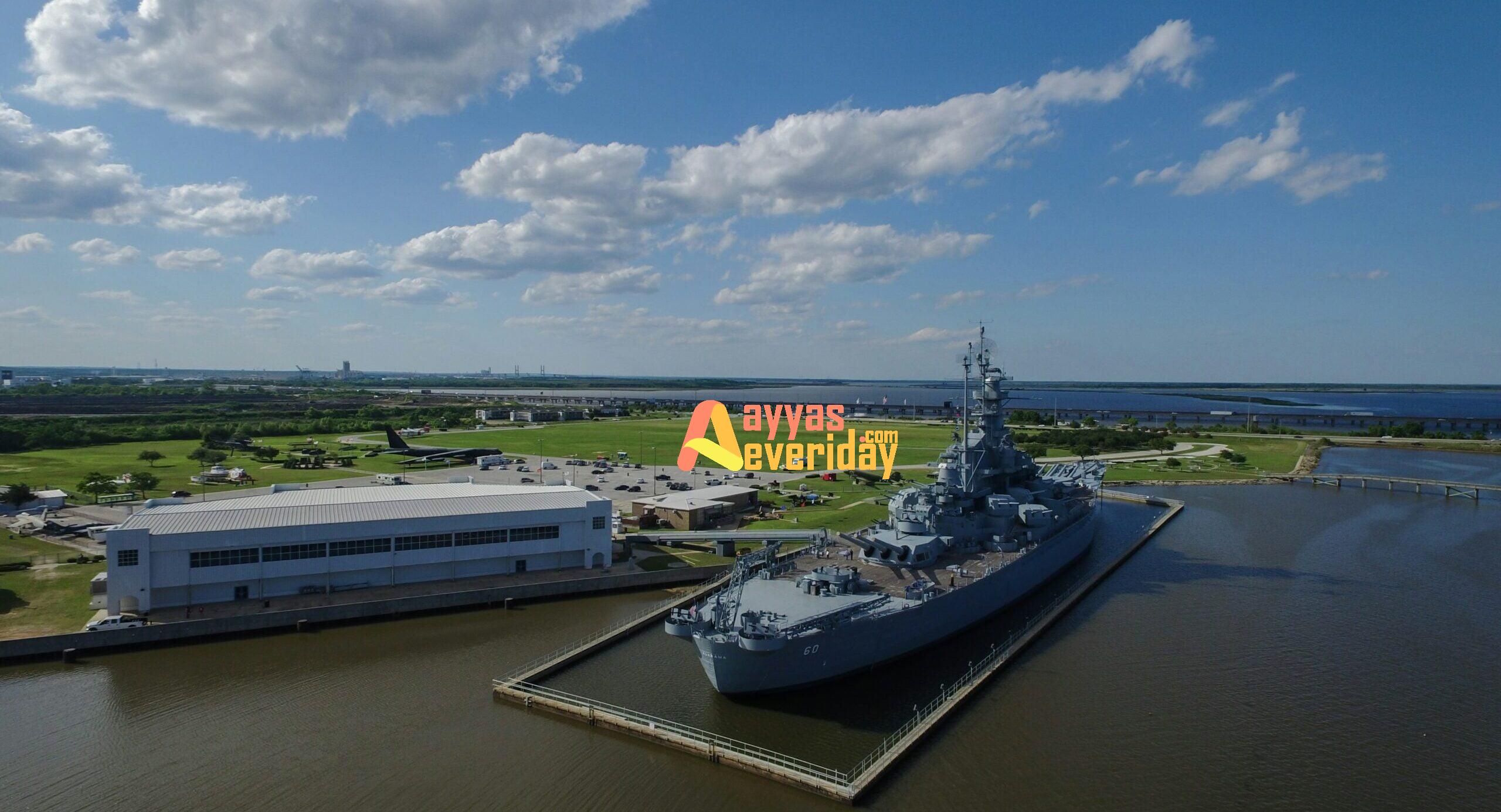 gray ship beside building